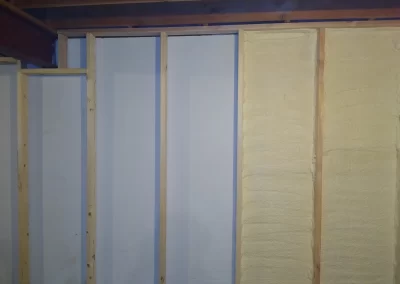 Drywall repair and prep service Redmond WA — framed walls with insulation ready for drywall