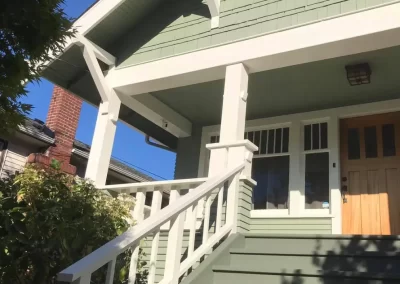 Exterior painting in Redmond WA — craftsman porch detail with white columns and trim