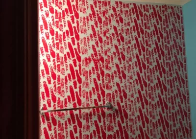 Interior house painting project in Redmond WA — decorative red pattern accent wall finish