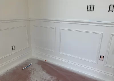 Wainscoting and trim painting Redmond WA — custom white panel trim on dining room walls